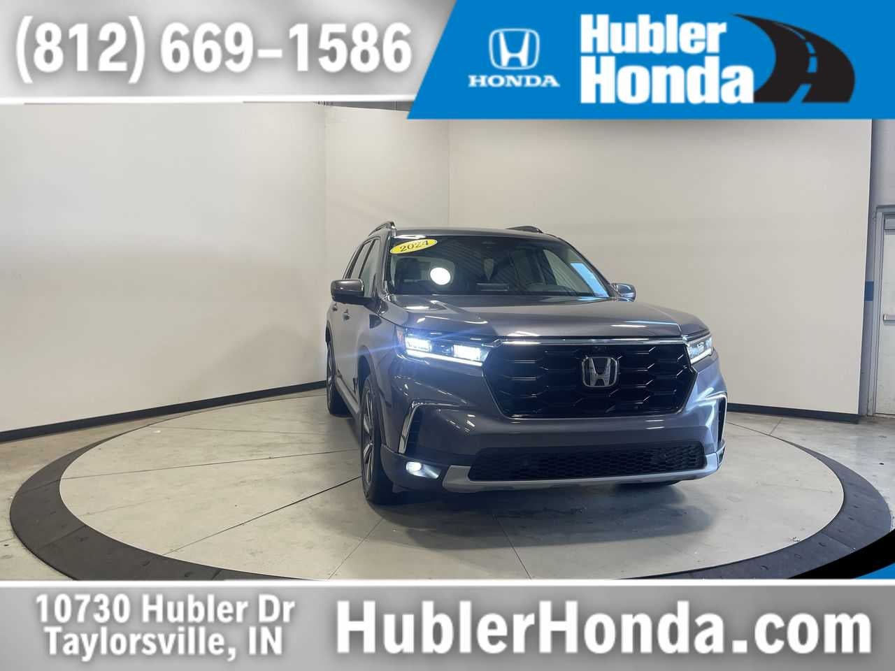 2024 Honda Pilot Elite in Modern Steel Metallic — front three-quarter view