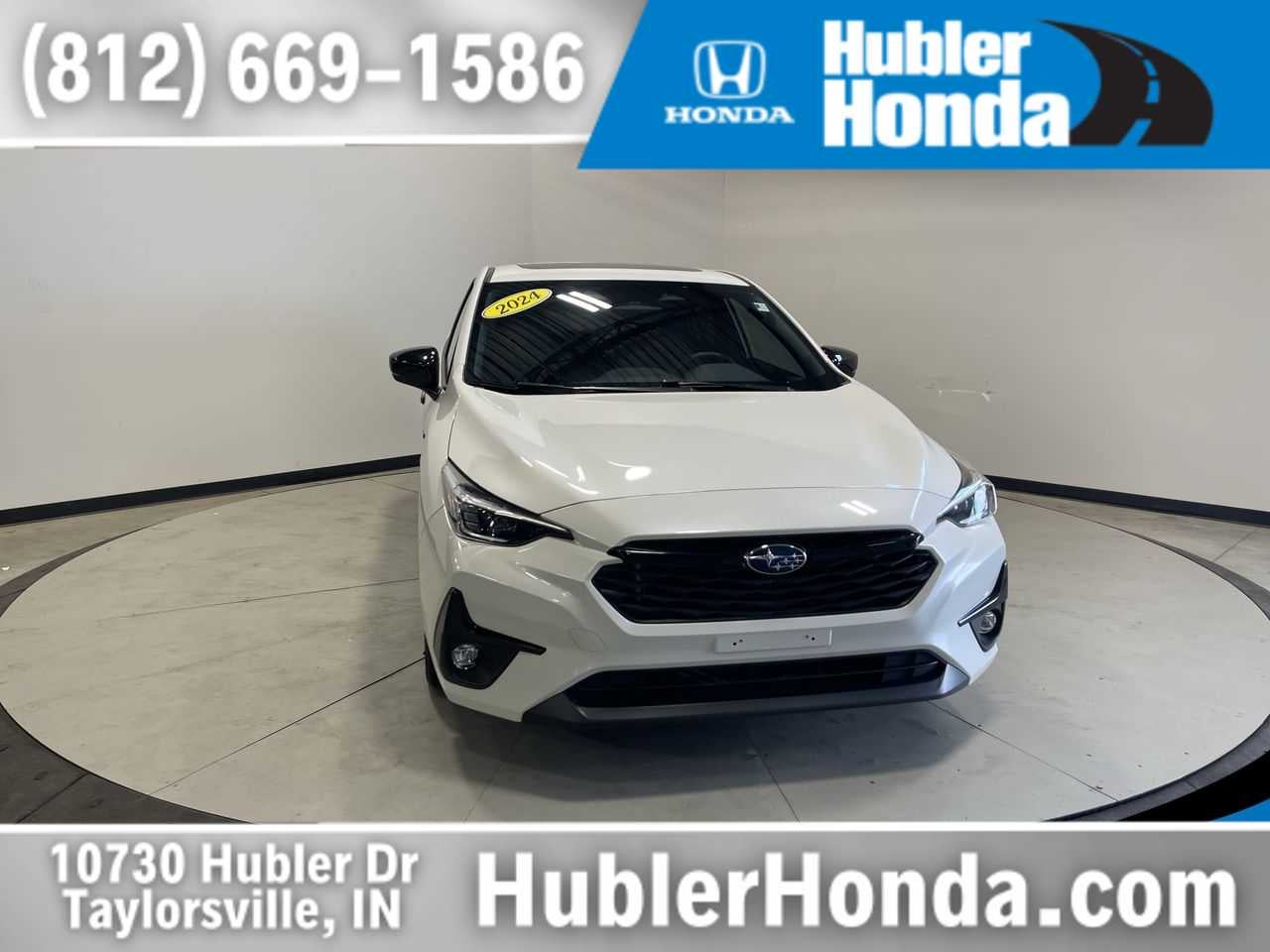 2024 Subaru Impreza RS in Crystal White Pearl — front three-quarter view