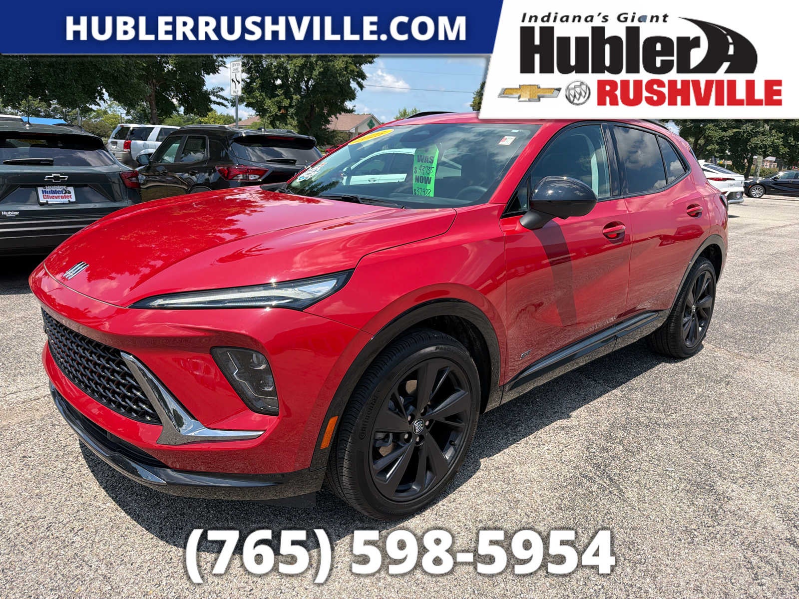 2025 Buick Envision Sport Touring in Brilliant Red — front three-quarter view
