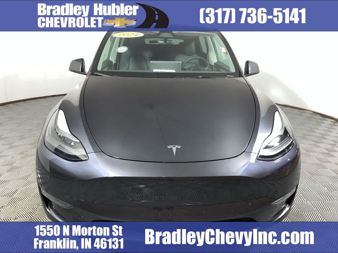 2024 Tesla Model Y Long Range in Gray — front three-quarter view