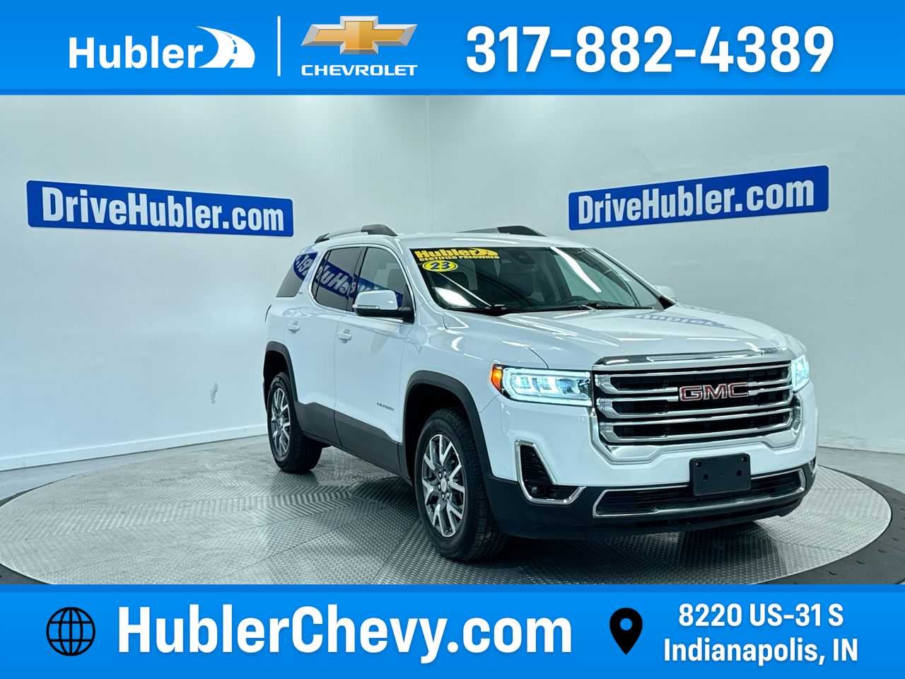 2023 GMC Acadia SLT in Summit White — front three-quarter view