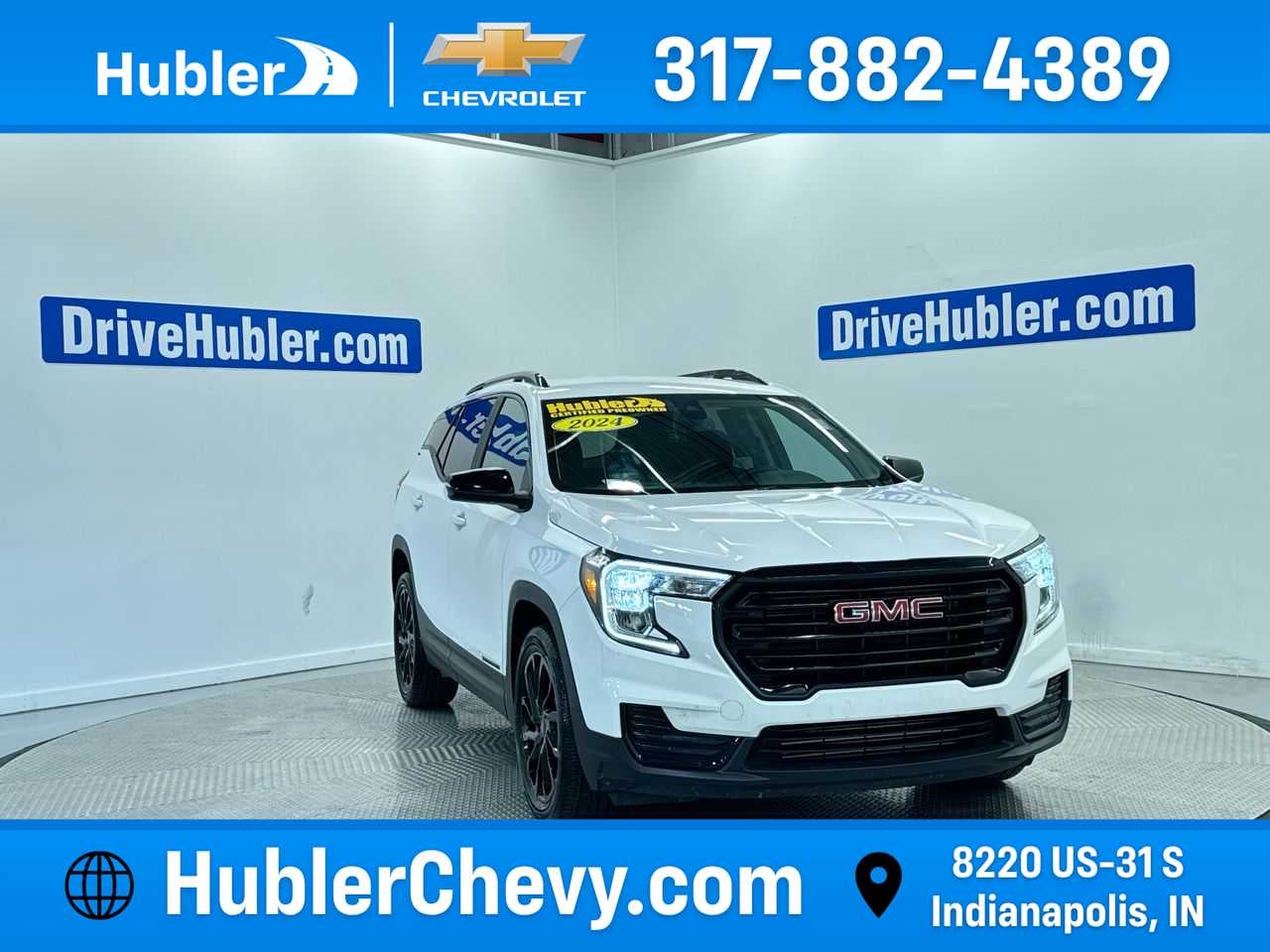 2024 GMC Terrain SLE in Summit White — front three-quarter view