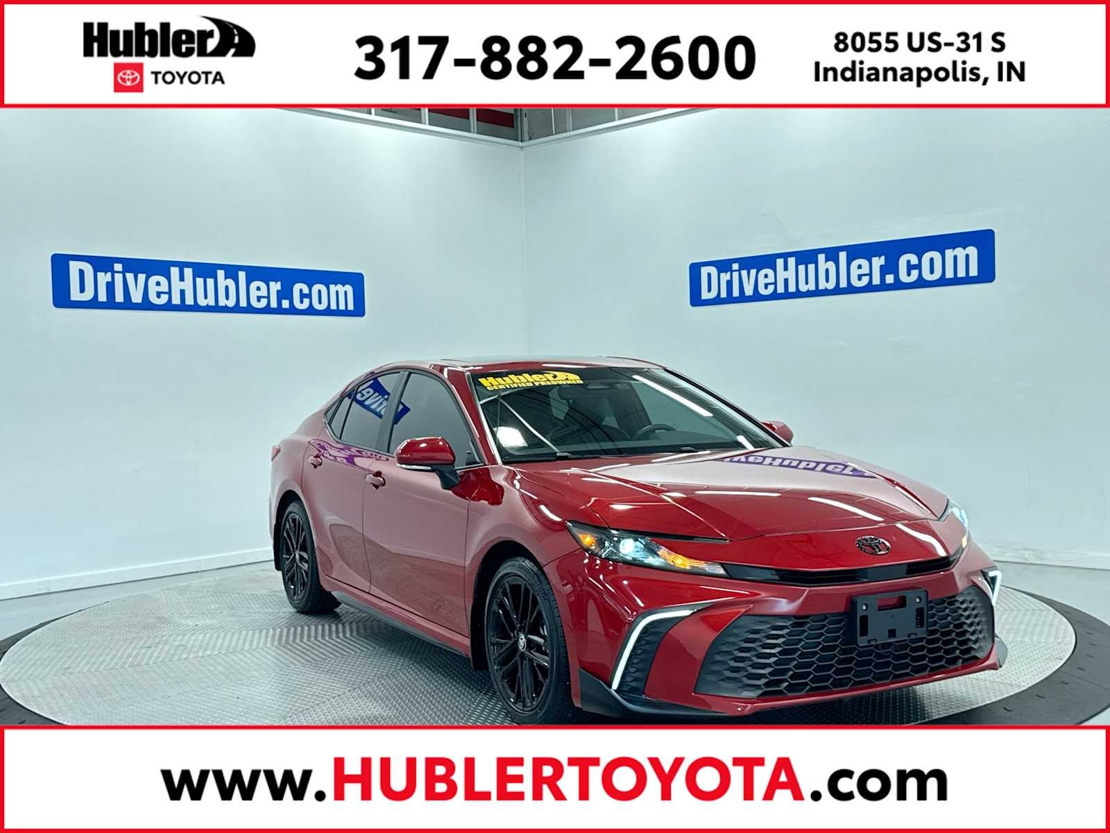 2026 Toyota Camry SE in Supersonic Red — front three-quarter view