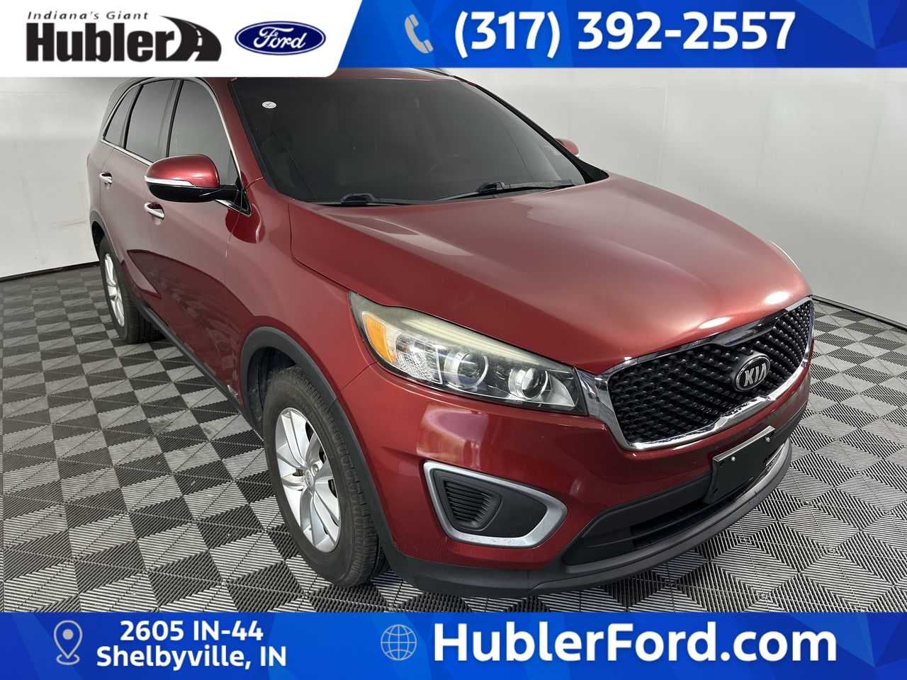 2017 Kia Sorento LX in Remington Red — front three-quarter view